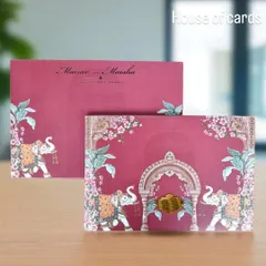 A vibrant pink Pichwai invitation showcasing caparisoned elephants and floral patterns, blending traditional Indian art with a contemporary color palette.