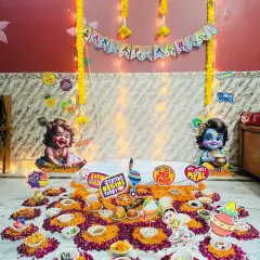 For this Krishna-themed Annaprashan, I arranged a beautiful spread for the first meal ritual. The setup includes a floral rangoli base, small bowls of food, and adorable cutouts of little Krishna to bless the special occasion.