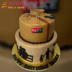 This cake is a heartfelt tribute to a real-life hero. I designed this two-tier cake to look like a police uniform, with personal touches like family silhouettes on the bottom tier to celebrate a husband, father, and grandpa on his birthday.