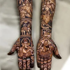 A truly divine design, this features a large, detailed Ganesha on one palm and other deities and symbols on the arms.