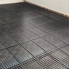 This is the first step of a professional artificial grass installation. We lay down drain cell panels to ensure proper water drainage and prevent waterlogging on your balcony or terrace.