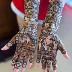 A clear shot of the completed engagement mehendi, showcasing the balance between the personalized story and classic Indian patterns.