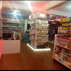 A view from our checkout counter, showing the central display for cat food and accessories. We keep our stores brightly lit and easy to navigate.