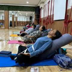This is what deep relaxation looks like in our therapy yoga sessions. Using props like bolsters and blocks, we guide you into restorative poses that release tension, calm the nervous system, and allow your body to heal.