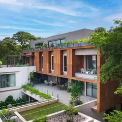 The U-L-I Residence, a 25,000 sq. ft. multigenerational home in Bangalore, is designed to exist in harmony with its lush surroundings. The structure integrates private decks and interconnected courtyards, creating a sanctuary that balances family connection with individual privacy.