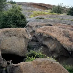 An even wider environmental shot, challenging you to spot the leopard in its rocky domain. This is what tracking in Jawai is all about.