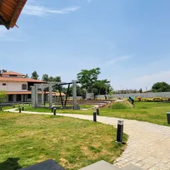 A view of a completed landscape project, featuring a winding stone pathway, strategically placed lighting, and a healthy lawn. We focus on creating designs that are not only beautiful but also practical and easy to navigate.