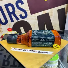 A highly realistic 3kg cake sculpted to look exactly like a bottle of Jack Daniels whiskey, perfect for a milestone birthday.