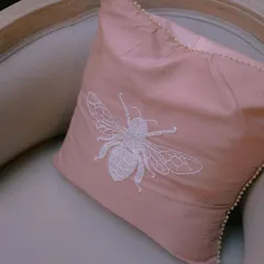 Details make the difference. For one wedding, we created custom upholstery with this beautiful hand-embroidered bee motif, adding a personal and whimsical touch to the decor.