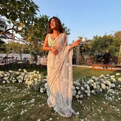 A full view of the Mishru saree. The sheer fabric and light colour create a dreamy, romantic feel, perfect for a wedding guest look.