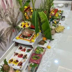 A traditional puja arrangement for a Griha Pravesh ceremony. We ensure all elements, like the kalash, coconut, and banana leaves, are correctly placed for an auspicious start.