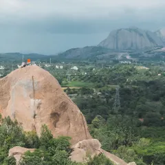Faith and climbing intersect at Gaali Kallu. Local villagers believe a rock formation on the spire is a statue of the bull-god Basava. We were honored to help them hoist a flag to the top, a strange and invigorating experience.
