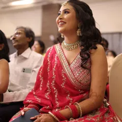 The happiness on her face says it all. This candid shot captures our bride enjoying her sangeet, looking effortlessly beautiful with her soft glam makeup.