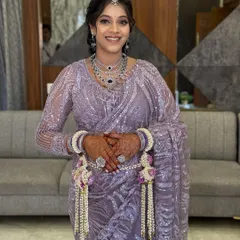 A smiling portrait of the happy mom-to-be. The soft glam makeup highlights her features without feeling heavy, ensuring she is comfortable throughout her event.