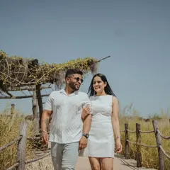 Walking and talking together, sharing a laugh. These unposed, in-between moments are often the most cherished, reflecting the easy companionship of the couple.
