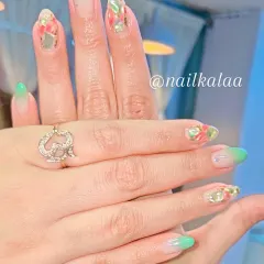 A vibrant set with a green ombre and encapsulated floral glitter. This design is fresh, colorful, and perfect for spring.