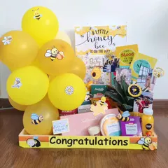 A 'Little Honey Bee' is on the way! This hamper is filled with bee-themed goodies, healthy snacks, and a small plant to congratulate the happy couple.