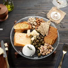 This cheese platter shot is a great example of my styling work. I carefully arranged each element, from the cheese and crackers to the olives and nuts, to create a composition that is balanced, abundant, and visually appealing.