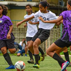 Teamwork in action as our players press together to win back the ball. We emphasize collective effort and tactical awareness.