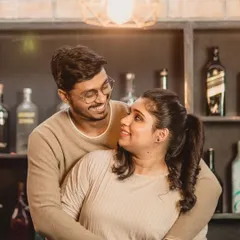 This cozy indoor shot shows a more casual look for the couple. I styled her hair in a simple high ponytail and kept the makeup minimal and fresh, perfect for this relaxed and happy moment.