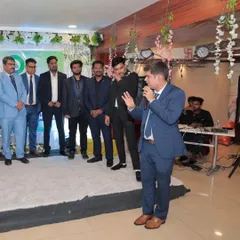 Addressing the team at a corporate gathering. I adapt my style to fit the occasion, bringing a formal yet engaging tone to conferences and annual meetings.
