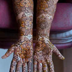 A full view of both hands, showing the symmetrical floral design. This is a popular choice for brides and for special occasions.