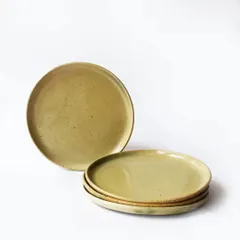 A set of our classic side plates in a warm, earthy lemon-green glaze with subtle speckles. These versatile plates are perfect for everyday meals, salads, or desserts.