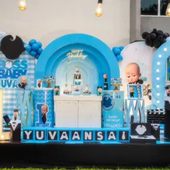 For the little boss in your life, this Boss Baby theme is all about sharp details. I used a cool blue and black color scheme, custom backdrops with layered arches for depth, and fun props like a light-up number '1' and money bags to bring the movie's playful corporate vibe to life.