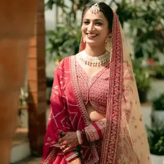 A radiant bride, smiling in the warm sunlight. This portrait captures her natural beauty and the joy of her wedding day.