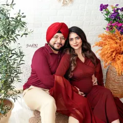 Such a beautiful couple, perfectly coordinated in deep red tones that pop against the neutral boho decor. I love capturing these cozy, seated poses that feel so natural and intimate.
