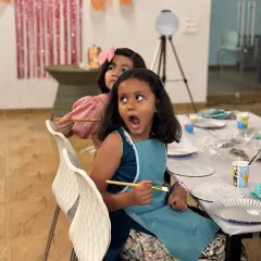The look of pure surprise and excitement. This little girl's expression is priceless. My public event stalls are all about creating these moments of spontaneous joy and creativity.
