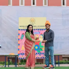 Receiving the award on behalf of my victorious Kho-Kho boys' team at a school ceremony. Their win is my win.
