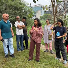Our volunteer Charu Govil leads a community walk at Ghata Bundh, guiding visitors through the restored 17-acre site and sharing stories of its transformation.