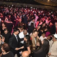 A dance floor filled with guests enjoying the music. We play a mix of genres that appeals to a diverse audience, ensuring everyone has a great time.