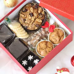 This is my popular Christmas Cheer Box, an assorted hamper perfect for festive gifting. It includes a rich walnut and fruit plum cake, fudgy brownies, classic butter cookies, and gingerbread treats, all packed beautifully for the holiday season.