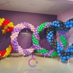 Students practicing basic balloon structures like these colorful heart-shaped rings during our decoration classes.
