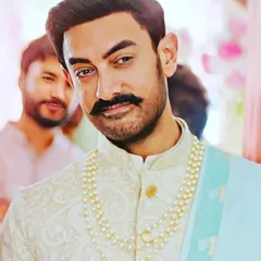 A closer look at the celebrity-inspired sherwani. We can recreate the subtle self-embroidery, the fit, and the overall look, including sourcing similar accessories like the pearl necklace.