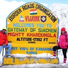 We made it to the top. Our group stands proudly at the iconic Khardungla Pass sign, the gateway to Siachen, at a breathtaking altitude of 17,982 feet. This is a key milestone in our high-altitude fitness trip.