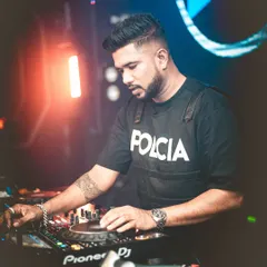 A professional portrait of me at the decks. This shot captures the focus and intensity I bring to every performance.