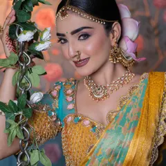 A close-up of a model wearing a beautiful pearl and stone matha patti and nose ring, part of my extensive bridal jewellery rental collection.