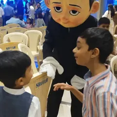 The Boss Baby mascot is a popular choice for first birthday parties. Here he is greeting some young guests and getting them excited for the celebration.