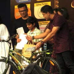 It's not just about singing, it's about the entire experience. Here, a young winner receives his prize, a brand new cycle, at the 'Singathon' finale.