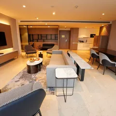 A dynamic low-angle shot that highlights the textures of the rug and the arrangement of modern furniture. This angle adds architectural interest and shows off the designer's choices.