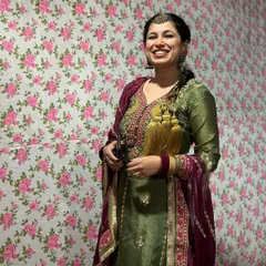 A beautiful Punjabi suit look. The olive green and wine color combination is rich and festive, perfect for a Lohri celebration or a Dhol night.