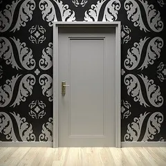 A high-contrast accent wall with a silver damask pattern on a black background. This kind of detailed pattern work is ideal for creating a dramatic and luxurious feel.