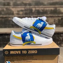 Believe! We created these custom Nike sneakers for a Ted Lasso fan, featuring the AFC Richmond team crest hand-painted over a yellow swoosh. The back of the shoe has the iconic "BELIEVE" sign.