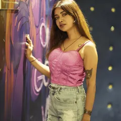 Posing against some cool graffiti art in Doha, Qatar. Exploring the city and its culture is one of the best parts of an international tour.