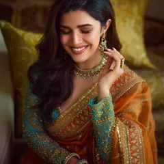 A candid, happy moment with Nimrat. The makeup is designed to look fresh and radiant from every angle, with a focus on luminous skin and a gentle smile that lights up the frame.