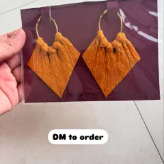 These mustard yellow macrame earrings are perfect for adding a pop of warm color to your look. The diamond tassel design is one of my favorites.