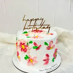 This hand-painted cake is one of my favorite styles to create. I use colored buttercream and a palette knife to paint abstract flowers directly onto the cake, making each one a unique piece of edible art.